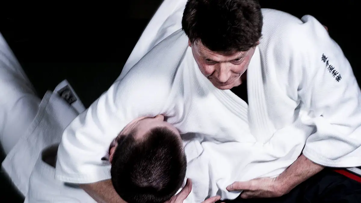 A photo of Satorikan Instructor, Greg Regan, demonstrating Kesa-Gatame on a student